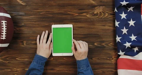 View from above on the white vertical tablet computer on the wooden table with Stock Footage 96316060