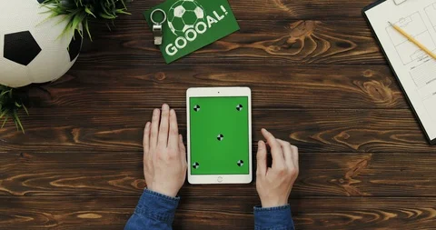 View from above on the white vertical tablet computer with chroma key screen in Stock Footage 96319125