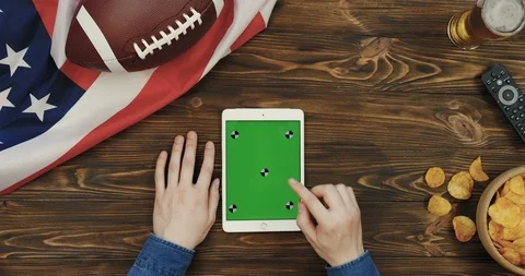 View from above on the white vertical tablet device in hands of a man on the Video stock 96321818