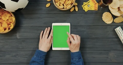 View from above on the white vertical tablet computer on the dark grey wooden Video stock 96343638