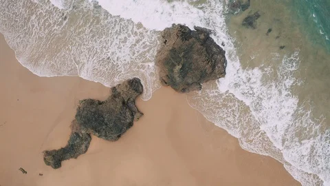 View from above of wide yellow sandy beach and waves Video stock 102929923