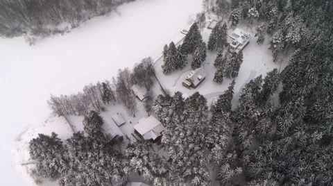 View from above of winter forest and house on edge Stock Footage 44753910