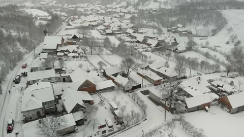 View from above, winter, of snow-filled houses, a flock of flying birds 44 Stock Footage 124065283