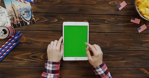 View from above on the woman's hands scrolling and taping on the white vertical Stock Footage 91731217