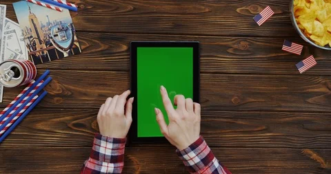 View from above on the woman's hands scrolling and taping on the black vertical Stock-Footage 91733168