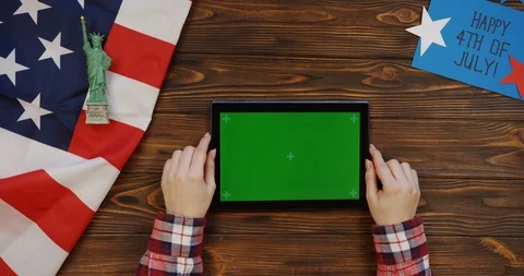View from above on the woman's hands scrolling and taping on the black Stock Footage 91742604