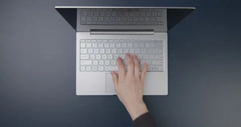 View from above. Workspace with laptop, tablet and woman Stock Footage 154691109