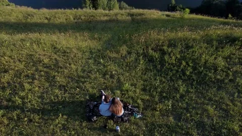 View from above on a young couple having time together near the calm water Stock Footage 159097644