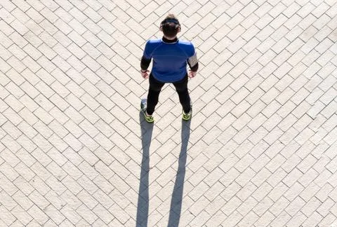 View from above of a young man working out listening to music. concept of hea Stock Photos