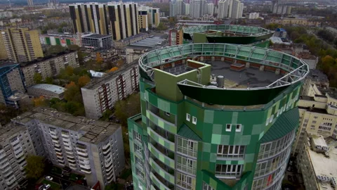 View from above.Flying over the roofs of two green skyscrapers. Stock Footage 132579800