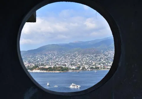 View of the Acapulco bay from a circular window Stock Photos
