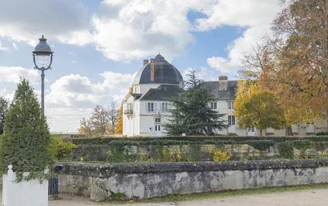 View across an acient wall at a castle with a dome shaped roof Stock Photos