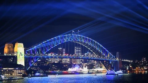 View across Circular Quay to Sydney Harbour Bridge lit up with light Stock Footage 128400972