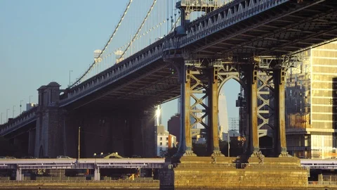 View across East River to traffic on FDR Drive crossing under Manhattan Bridge Stock Footage 99094396