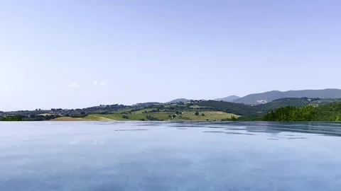 View across infinity pool towards distant rolling hills Stock Footage 342344240