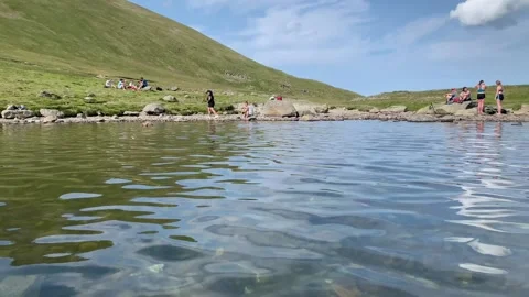 View across the water at Grisedale Tarn in the Lake District Stock Footage 157679799