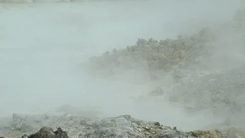 View of an active crater spewing white hot steam Stock Footage 319906850