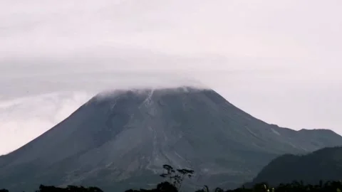 VIEW AN ACTIVE VOLCANO MOUNTAIN WITH BLUE SKY IN THE MORNING Video stock 203095909