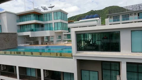 View of the adjacent condominium with infinity pool Stock Footage 156866854