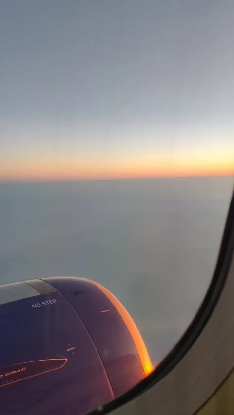 View of aeroplane engine from my window on the sunrise morning Stock Footage 142489112