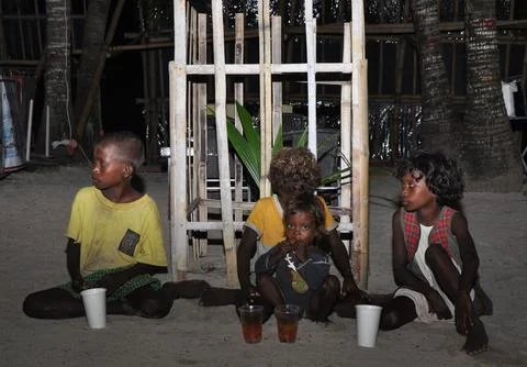 View of Aetas a Negrito ethnic children sitting on sand Stock Photos