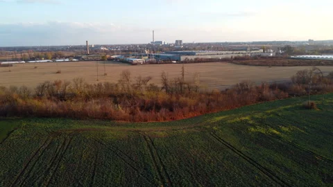 View of agricultural fields with green plants, yellow field after harvest Stock Footage 330678570