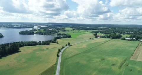 View of agricultural fields, lakes and road with cars in summer Stock Footage 138040047