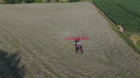 A view ahead of the tractor but following it (drone shot) Stock Footage 312275947