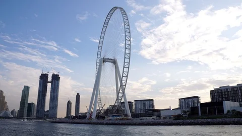 View on the Ain Dubai Eye Ferris wheel from the water Video stock 121782555