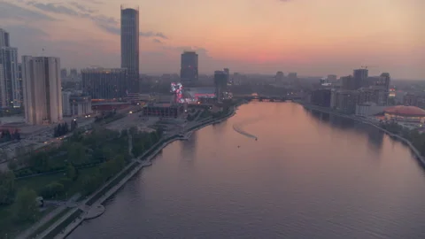 View from the air at a beautiful pink sunset over the river in the city centre Stock Footage 135807622