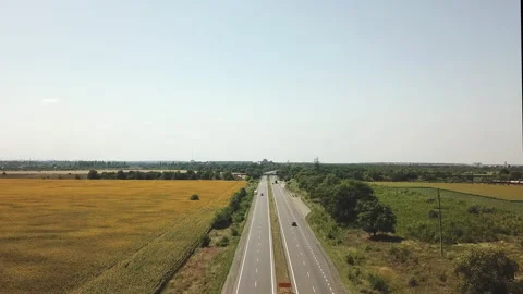 View from the air with the help of a drone on the road with a moving car  Stock Footage 196382324