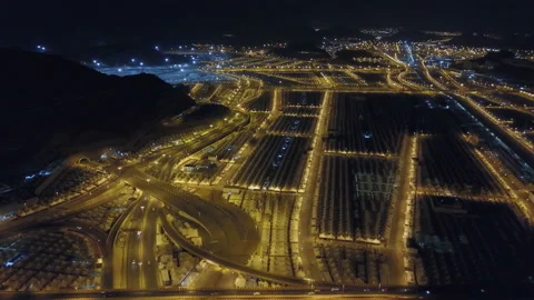 A view from the air at night to the tent camp of pilgrims in the Mina Valley Stock Footage 106672717