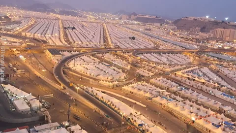 A view from the air at night to the tent camp of pilgrims in the Mina Valley Video stock 106915683