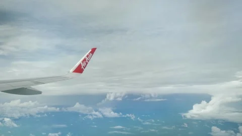 View of the airaisa airbus a320 plane wing through the airplane window flyi.. Video stock 312166344