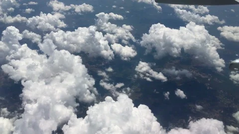 View from aircraft window with blue sky and clouds Stock Footage 89694694