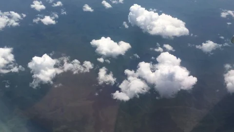 View from aircraft window with blue sky and clouds Stock Footage 89695439