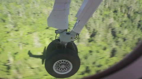 The view from aircraft window to plane shassis durring the landing Stock Footage 61790768