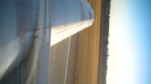 View from aircraft window on wing and runway during plane take off in airport. Vidéo 240188764