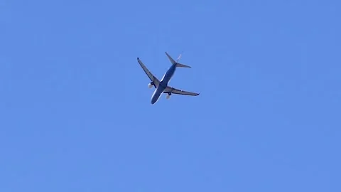 View of an airliner in flight from below Stock Footage 346416142
