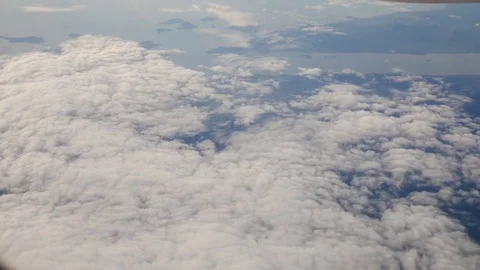 A view from the airplane. The aircraft is flying through the clouds Stock-Footage 71754543