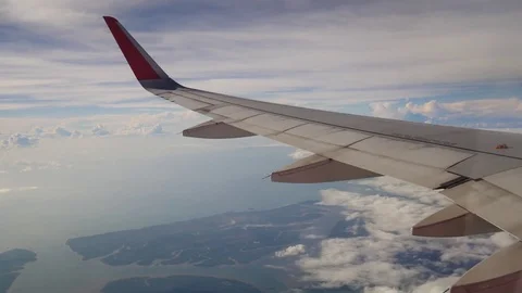 A view from the airplane. The aircraft is flying through the clouds 動画素材 71754580
