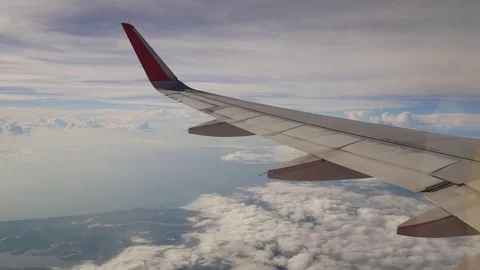 A view from the airplane. The aircraft is flying through the clouds Видео 71754633