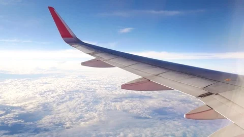 A view from the airplane. The aircraft is flying through the clouds 動画素材 71754825