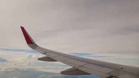 A view from the airplane. The aircraft is flying through the clouds Vídeo Stock 71755037