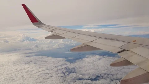 A view from the airplane. The aircraft is flying through the clouds Vídeos de archivo 71755425