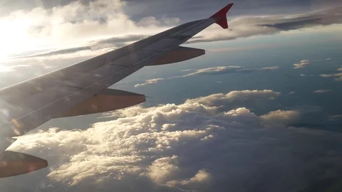 A view from the airplane. The aircraft is flying through the clouds Stockbeeldmateriaal 71943095