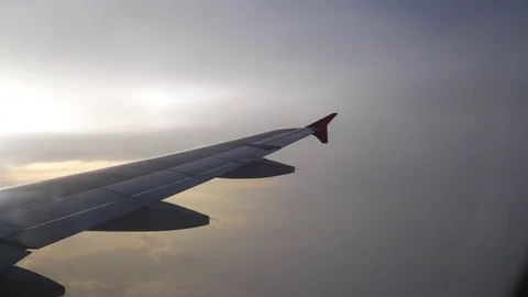 A view from the airplane. The aircraft is flying through the clouds Video stock 71943484