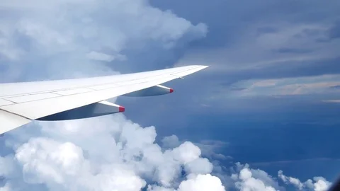 A view from the airplane. The aircraft is flying through the clouds.Air tra.. Vídeo Stock 75887427