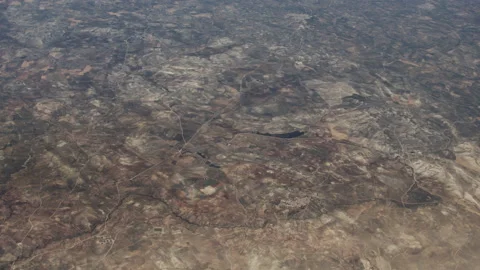 View From Airplane Of Brown Patchwork Landscape Video stock 147101046