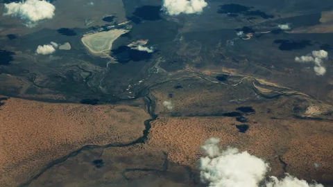 View from the airplane. Clouds. Aerial Stock Footage 133784197